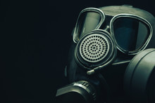 Close Up Gas Mask On A Black Table And Dark Background.