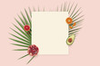 Summer holiday card copyspace. Fruit flatlay top view with paper on the pink background. Pomegranate, orange, avocado