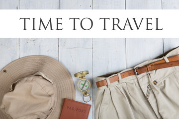 Prepare for journey in africa style - text Time to travel, accessories and travel items, packing clothes in backpack: backpack, passport, hat, shorts, compass