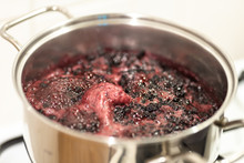 Close-up View Of Boiling Blueberries. Cooking Blueberry Jam.