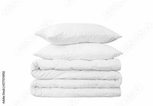 Stack of two pillows and on the white background, two white pillows on the rolled duvet isolated, bedding objects isolated against white background, bedding items catalog illustration, bedding mock up