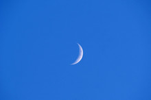 Half Moon At Blue Sky