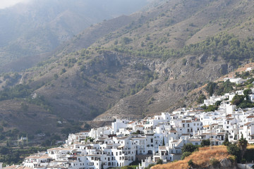 Wall Mural - Spain, the village of Frigiliana in Andalusia, southern Spain. The dramatic hills and valleys that surround this very pretty village.