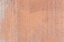 Close-up Of Plastered, Painted, Weathered, Rough And Red, Orange Or Peachy Concrete Or Stone Wall. High Resolution Full Frame Textured Background.