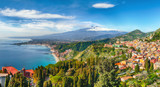 Fototapeta  - Aquamarine blue waters of sea near Taormina resorts and Etna volcano mount