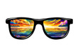 Sunglasses with sunset reflection on the sea. Color art image points with the reflection of the beautiful sunset and the sea.