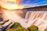Fototapeta Fototapety z mostem - Dettifoss waterfall in Iceland. Charming sunset view of iconic Icelandic landmark - waterfall Dettifoss in Vatnajokull National Park, one of the most powerful European waterfalls.