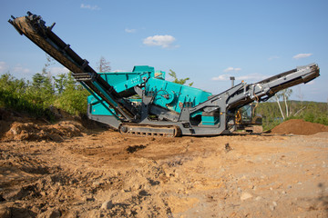 A big screener on a job site in the summer in the day time 