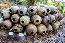 Group Of The Antique Thai Traditional Clay Jars Placed On The Floor In Thailand