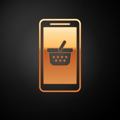 Poster - gold mobile phone and shopping basket icon isolated on black background. online buying symbol. super