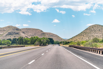 Tinnie New Mexico countryside road view from 380 highway with desert landscape and nobody on 70 west by Sacramento Mountains