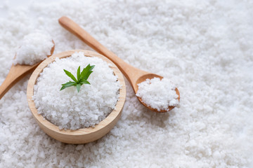 Sea salt on wood plate.