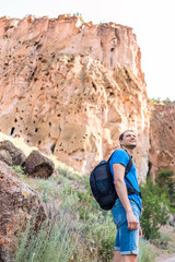 Wall Mural - los alamos park with man hiking walking on main loop trail path in bandelier national monument in ne