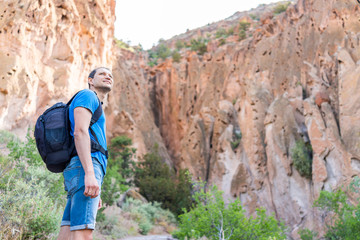Wall Mural - park with man hiking on main loop trail path in bandelier national monument in new mexico during sum