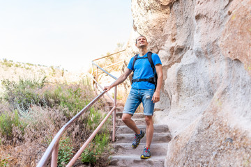 Wall Mural - los alamos park with man hiking walking on steps of main loop trail path in bandelier national monum