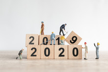 Miniature Worker Team Create Number 2020 And Remove Number 2019  , Happy New Year  Concept