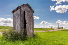 Old Wooden Outhouse On The Prairie Countryside In Saskatchewan, Canada