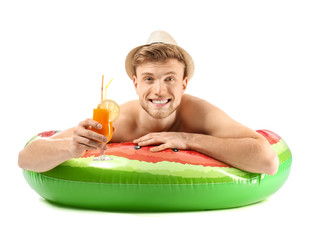 Sticker - Funny young tourist with inflatable ring and cocktail on white background