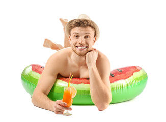 Sticker - Funny young tourist with inflatable ring and cocktail on white background