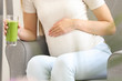 © Pixel-Shot - Beautiful pregnant woman drinking smoothie at home