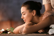 canvas print picture - Beautiful young woman receiving massage in spa salon