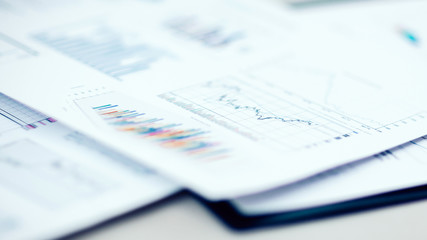 Wall Mural - growth charts and financial data on the office Desk