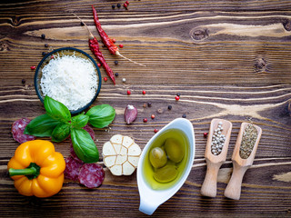 Wall Mural - The ingredients for homemade pizza on shabby wooden background.