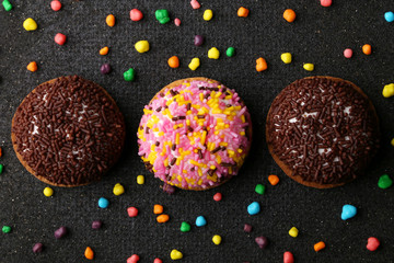 Wall Mural - Chocolate Crinkle cookies. close-up of Crinkle cookies chocolate biscuits on Christmas cookies on a black plate, view from above.