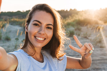 Sticker - Beautiful young woman having a lovely time at the beach