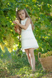 © nuzza11 - Child with grapes on nature.