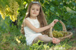 © nuzza11 - Child with grapes on nature.