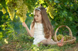 © nuzza11 - Child with grapes on nature.