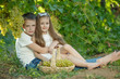 © nuzza11 - Child with grapes on nature.