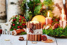 Candle Decorated With Cinnamon Sticks