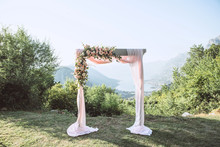 Beautiful Wedding Arch With Flowers On The Background Of The Boko-Kotor Bay In Montenegro. Preparation For A Wedding Event.