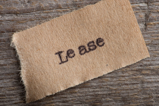 Lease typed text on a paper, real estate concept