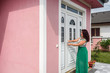 © mirsad - young woman or girl puts key in the keyhole of front door pvc