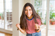 © Krakenimages.com - Beautiful young woman celebrating excited for success, screaming and smiling for winning