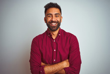 Young Indian Man Wearing Red Elegant Shirt Standing Over Isolated Grey Background Happy Face Smiling With Crossed Arms Looking At The Camera. Positive Person.