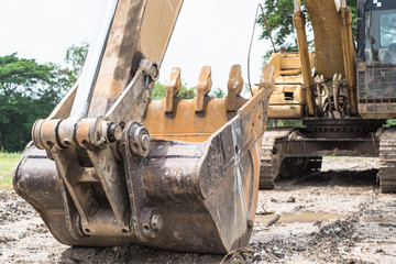 Wall Mural - Excavator arm and backhoe. Close up of digger excavator bucket bulldozer shovel detail.