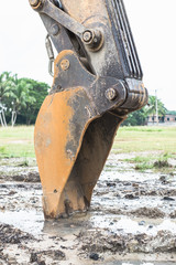 Wall Mural - Excavator arm and backhoe. Close up of digger excavator bucket bulldozer shovel detail.