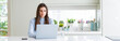 © Krakenimages.com - Wide angle picture of beautiful young woman working or studying using laptop with a confident expression on smart face thinking serious