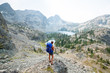 © Tandem Stock - Rear view of hiker looking at Sheep Lake while standing on cliff