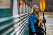 © Tandem Stock - A female kayaker with a drysuit and full boating gear at the Three River Motel along the Lochsa River in Idaho.