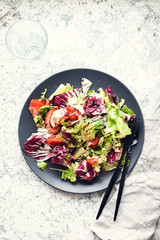 Wall Mural - Vegetable salad mix on a wooden table