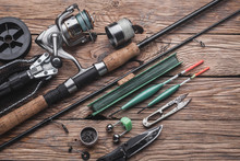Fishing Tackle For Fishing Peaceful Fish. Float, Fishing Rod, Reel, Fishing Line On The Wooden Background