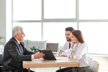 Canvas Print - Couple meeting with notary public in office