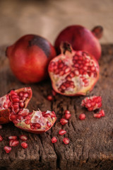 Ripe pomegranate fruit on wooden  background. - Image