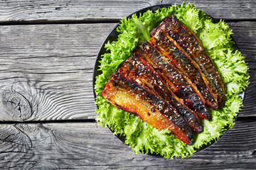 Canvas Print - roasted fillets of mackerel fish with lettuce