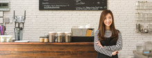 Young Woman Owner Of A Cafe Stand In Front Of Coffee Counter, Young Entrepreneur Conceptual, Dimension Image For Banner